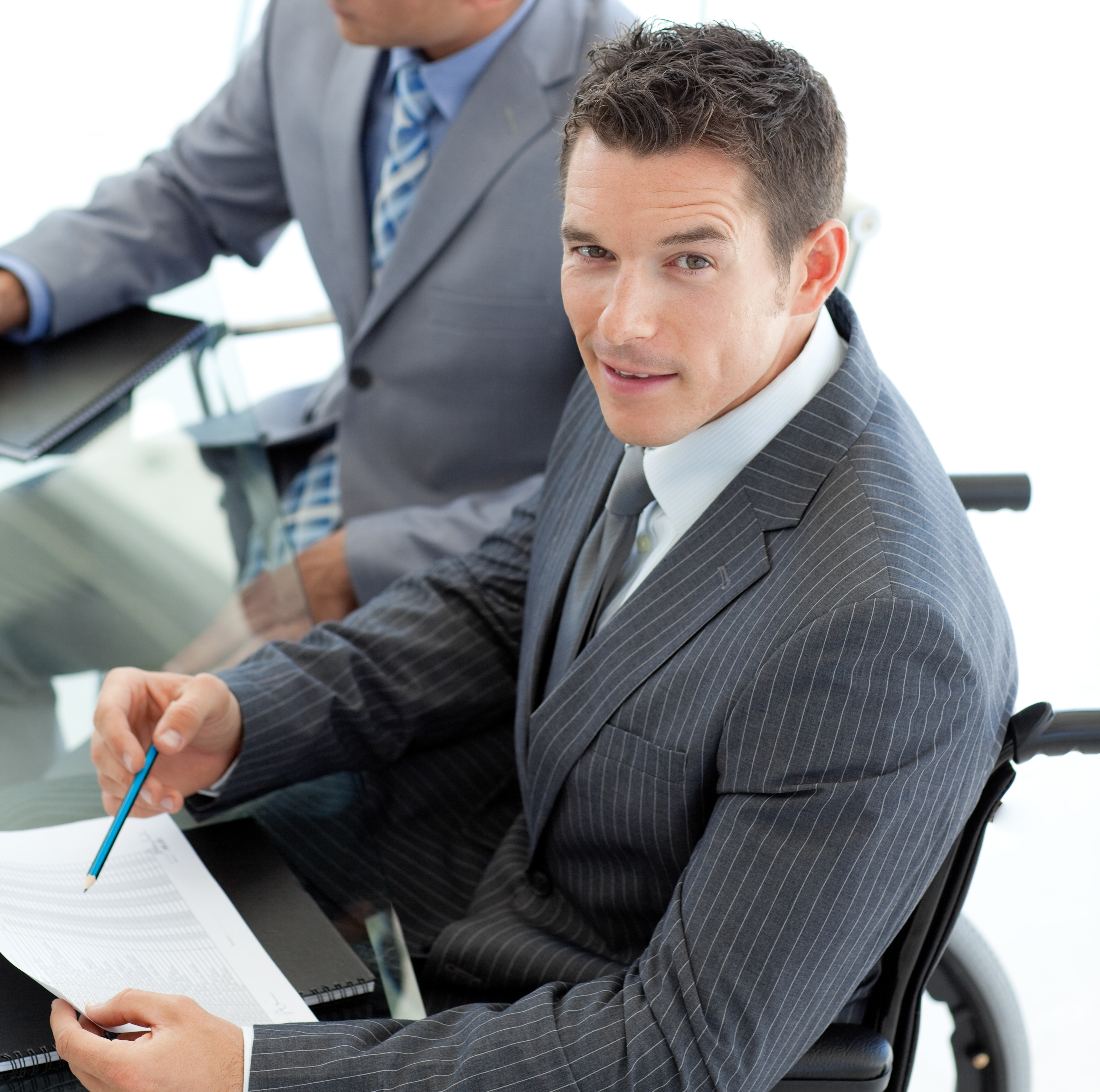 two men wearing suits, one in a wheelchair, providing Job Interview Guidance